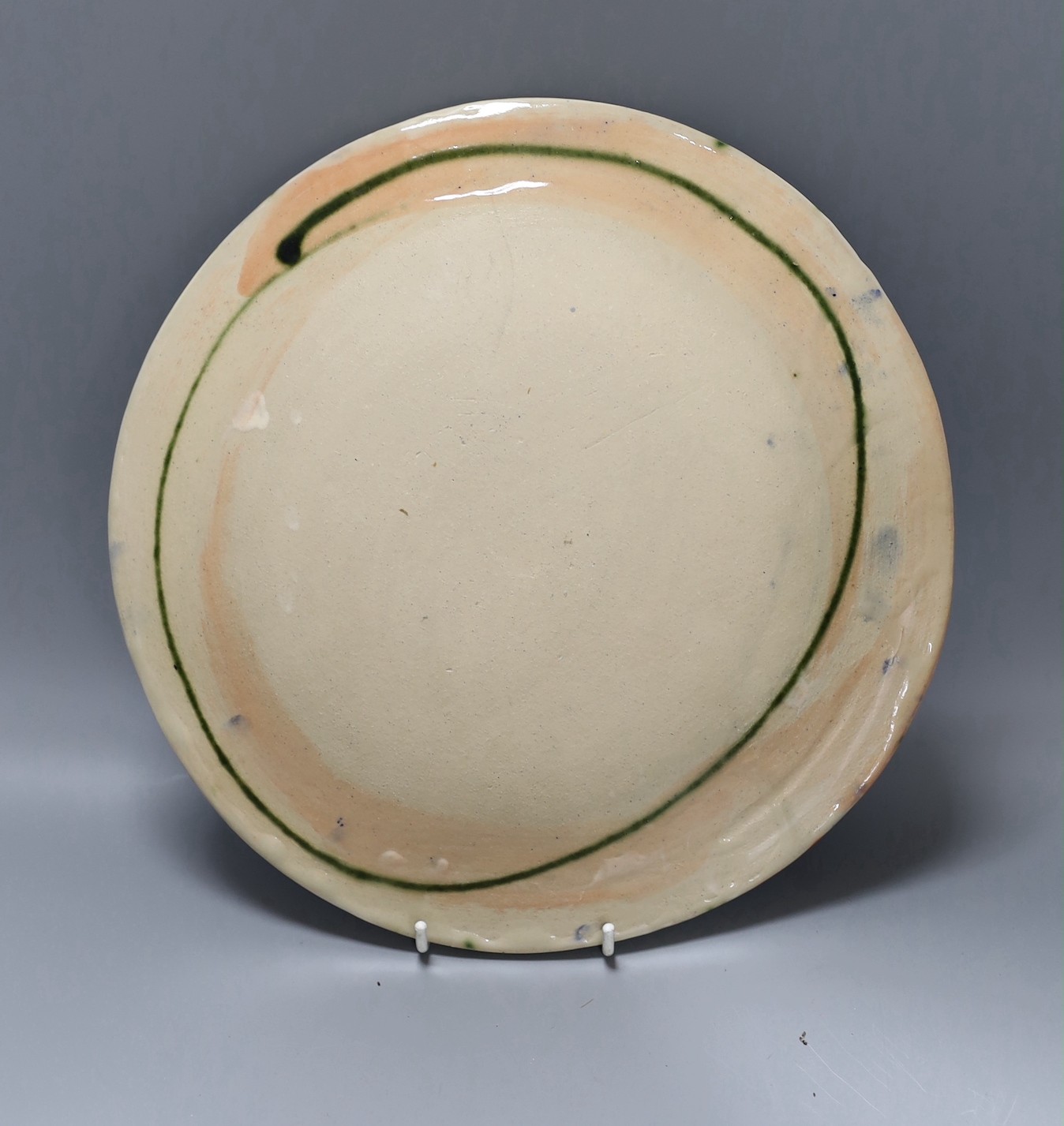 A Sandy Brown glazed pottery dish, signed, 26cm
